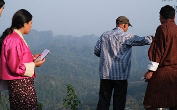 The student teams with local stakeholders explaining initiatives such as the plantation of local vegetation for hazard mitigation. Bhutan, 2023