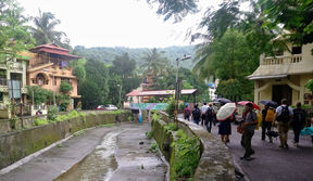 Picture of people walking next to a river in India